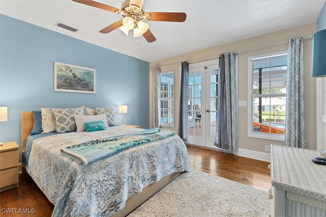 bedroom featuring ceiling fan, dark hardwood / wood-style flooring, access to outside, and french doors