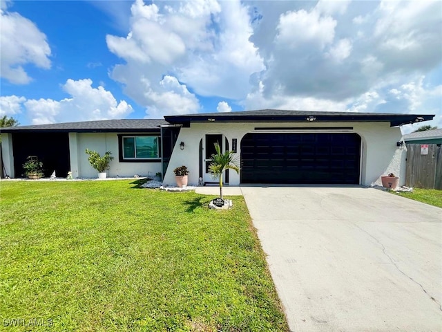 single story home featuring a garage and a front yard