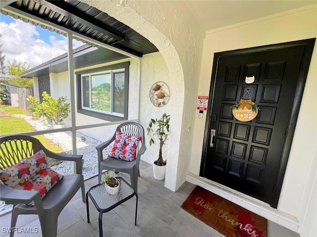 doorway to property featuring a porch