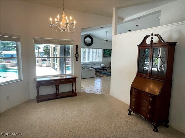 28124 Meadowlark Ln, Bonita Springs, FL 34134 - corridor featuring high vaulted ceiling, a chandelier, tile patterned floors, and carpet