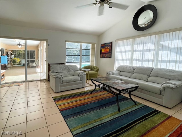 living room with light tile patterned floors, vaulted ceiling, and ceiling fan