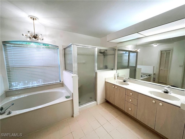 28124 Meadowlark Ln, Bonita Springs, FL 34134 - full bath featuring a sink, a chandelier, a shower stall, a bath, and double vanity
