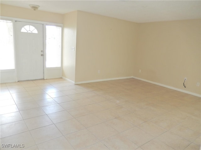 entrance foyer featuring light tile patterned flooring