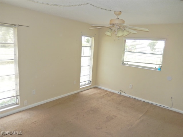 carpeted empty room with ceiling fan