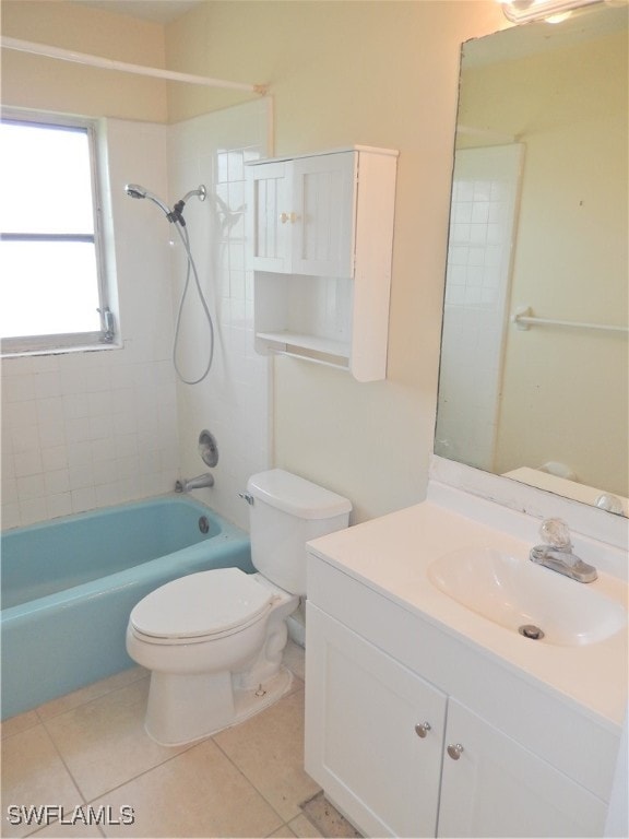 full bathroom with tile patterned flooring, toilet, vanity, and tiled shower / bath