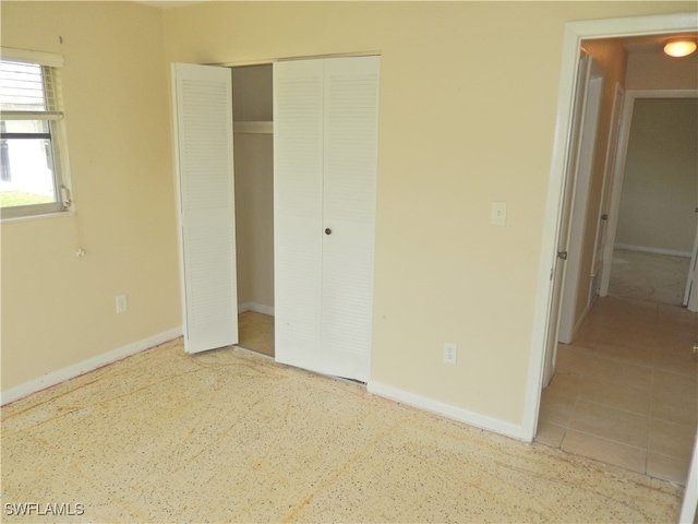 unfurnished bedroom featuring a closet