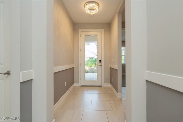 doorway with light tile patterned flooring