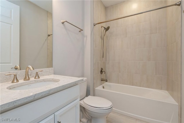 full bathroom featuring tub / shower combination, vanity, and toilet