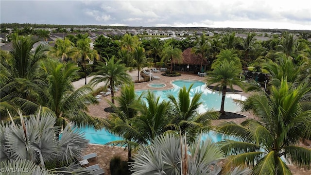 community pool featuring a patio and a hot tub