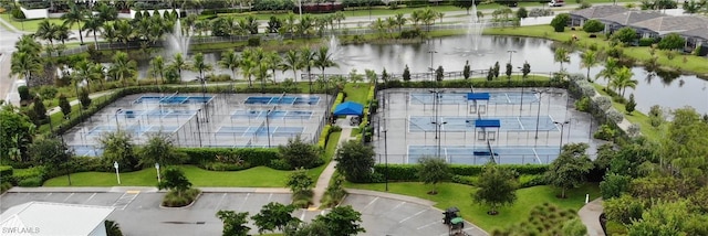 birds eye view of property with a water view