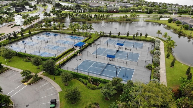 birds eye view of property with a water view