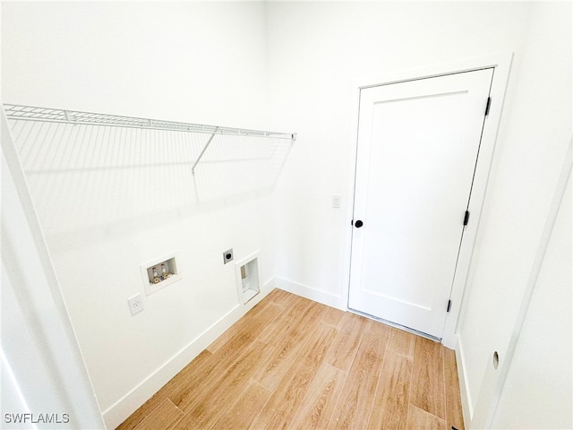 laundry room with wood-type flooring, hookup for an electric dryer, and hookup for a washing machine