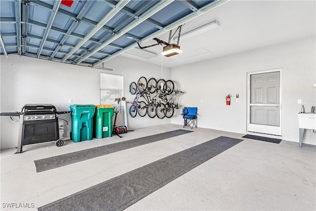 8084 Sanctuary Dr Unit 1, Naples, FL 34104 - garage featuring a garage door opener