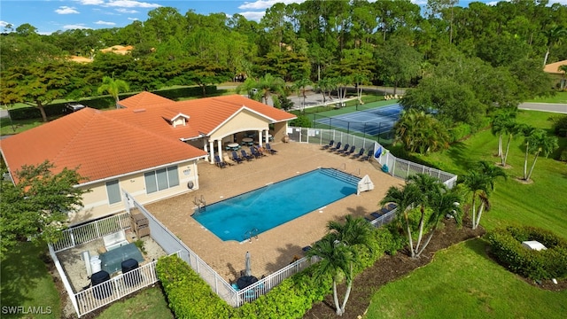8084 Sanctuary Dr Unit 1, Naples, FL 34104 - community pool featuring a fenced backyard and a patio area