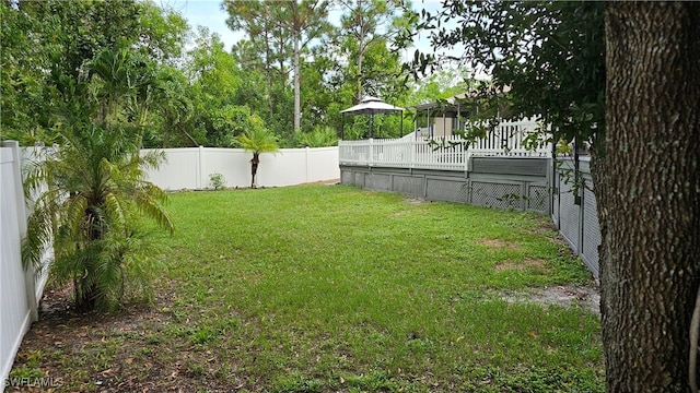 view of yard featuring a gazebo and a deck