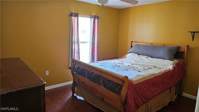 bedroom featuring dark hardwood / wood-style floors and ceiling fan