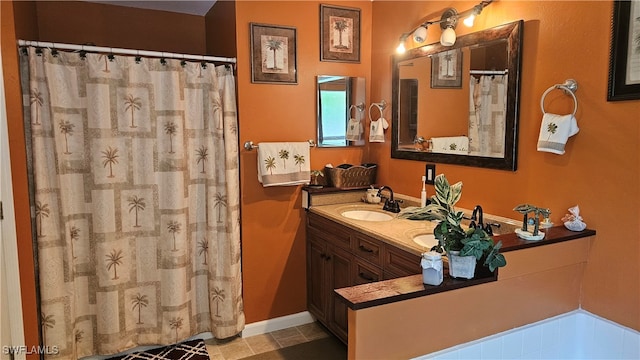 bathroom with tile patterned floors and vanity