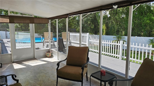 sunroom / solarium featuring lofted ceiling