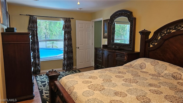 bedroom with hardwood / wood-style flooring