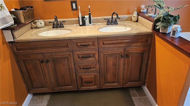 bathroom with tile patterned flooring and vanity