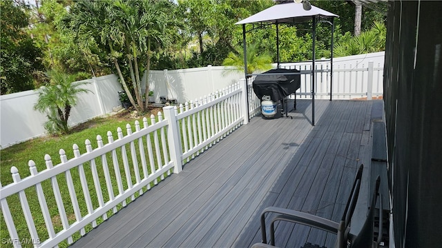 wooden terrace with a yard