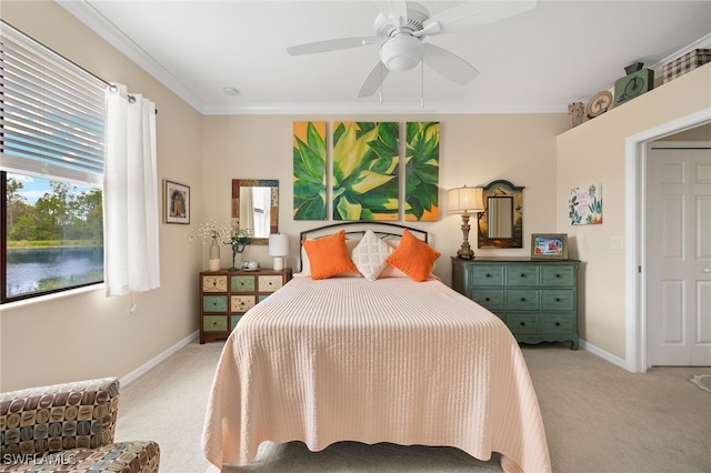 bedroom featuring light carpet, ornamental molding, a ceiling fan, and baseboards