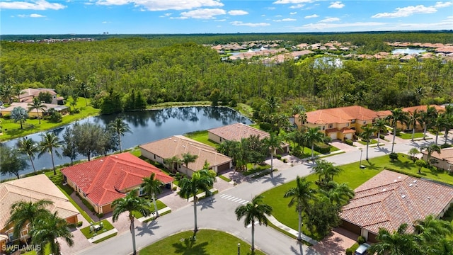 bird's eye view featuring a residential view, a water view, and a view of trees