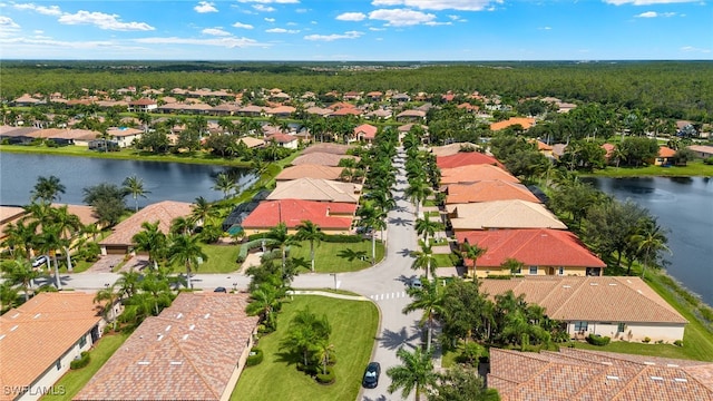 bird's eye view with a water view and a residential view