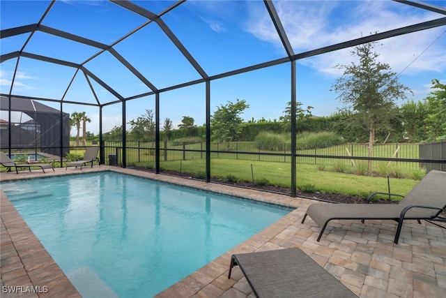 view of pool featuring a lanai, a lawn, and a patio