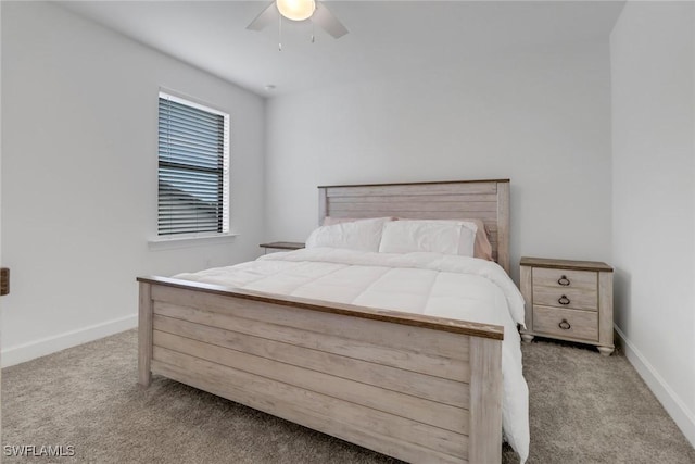 bedroom with ceiling fan and light carpet