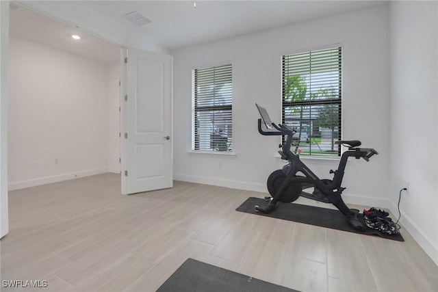 workout area featuring light hardwood / wood-style floors