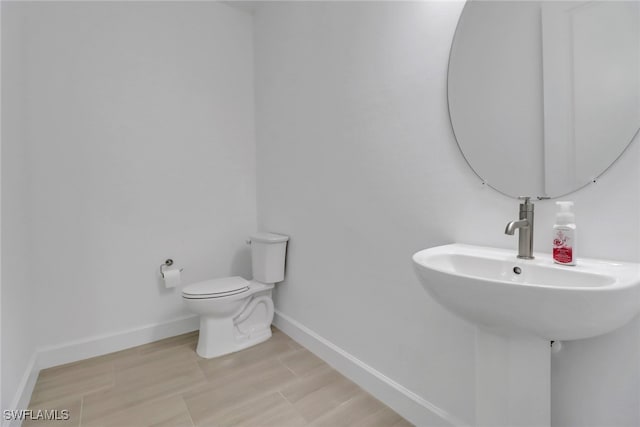 bathroom featuring toilet