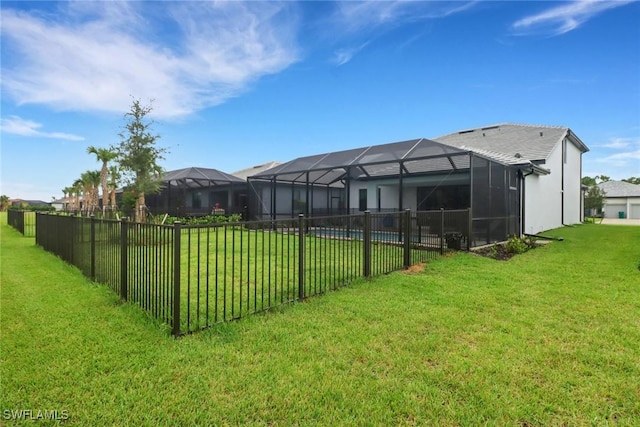 view of yard with a fenced in pool and a lanai