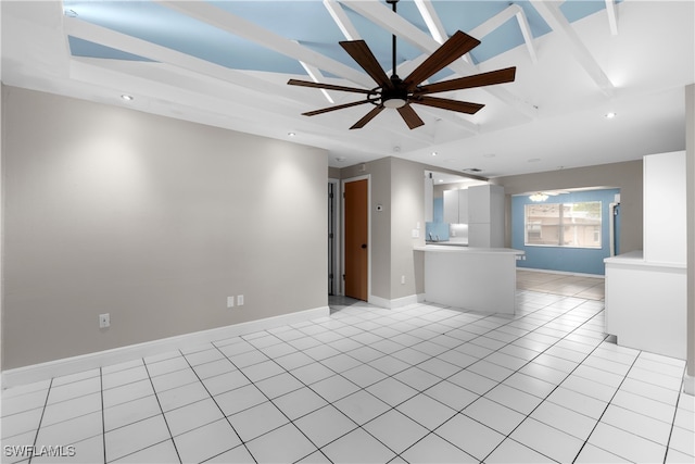 unfurnished living room featuring light tile patterned floors, ceiling fan, and a tray ceiling