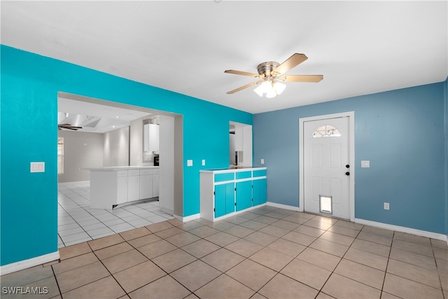 interior space featuring ceiling fan and light tile patterned flooring