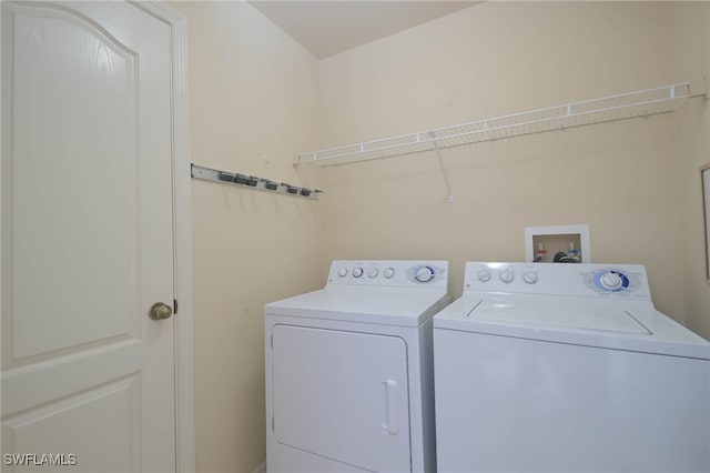 washroom with washer and dryer