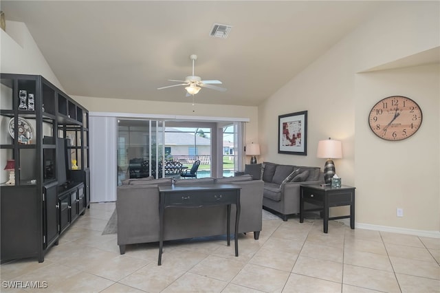 living room with vaulted ceiling, ceiling fan, and light tile patterned floors