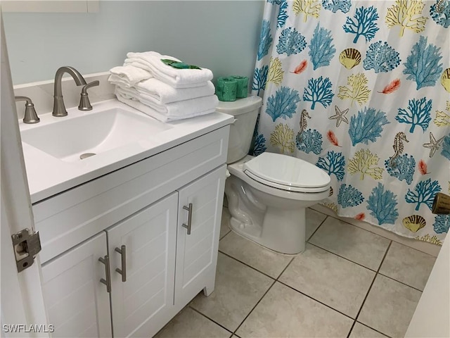 7330 Estero Blvd Unit 502, Fort Myers Beach, FL 33931 - bathroom featuring vanity, tile patterned flooring, toilet, and a shower with shower curtain