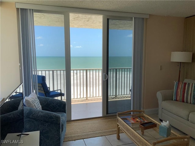 7330 Estero Blvd Unit 502, Fort Myers Beach, FL 33931 - living area featuring view of water and beach and tile patterned flooring