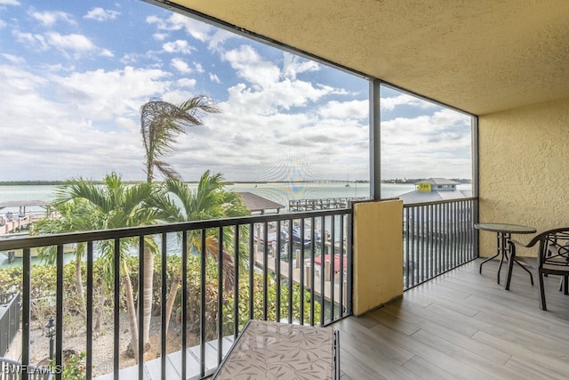 balcony featuring a water view