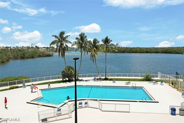 view of pool with a water view