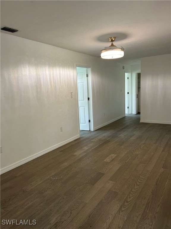 spare room with hardwood / wood-style flooring