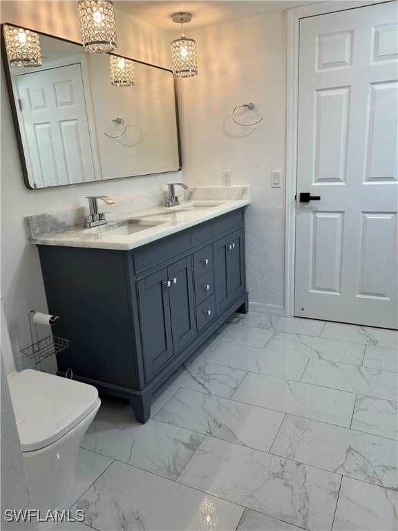 bathroom with toilet, tile patterned flooring, and vanity