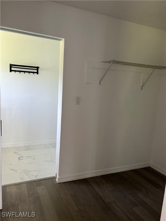 spacious closet featuring hardwood / wood-style floors