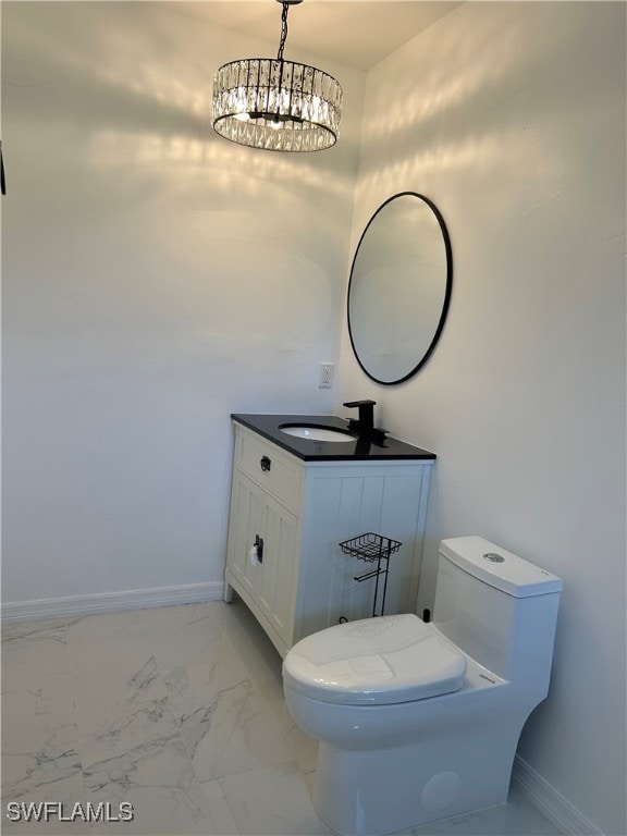 bathroom featuring tile patterned floors, toilet, and vanity