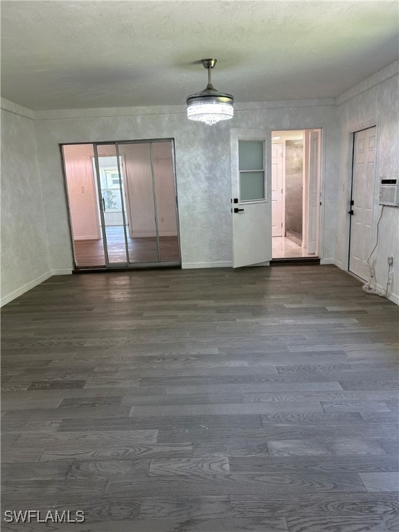 spare room featuring wood-type flooring