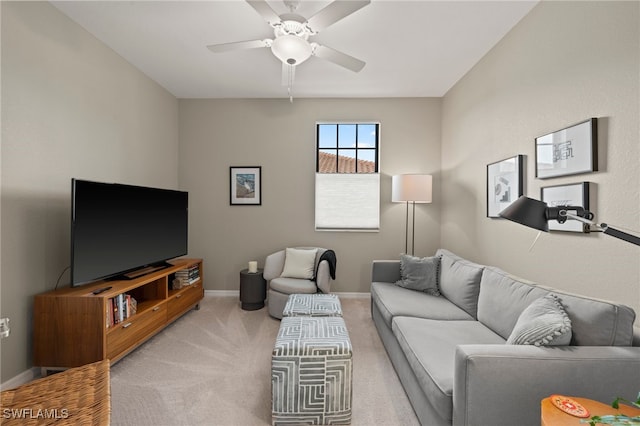 carpeted living room with ceiling fan