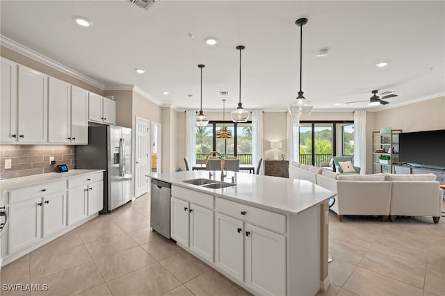 kitchen with light tile patterned floors, appliances with stainless steel finishes, and sink