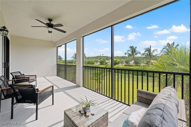 sunroom / solarium with ceiling fan