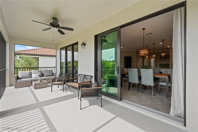 view of patio / terrace featuring ceiling fan and an outdoor living space